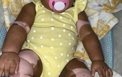 Young woman puts daughter inside the fir… See more